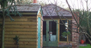 Wooden shed with green door