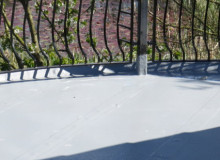 glass reinforced plastic roof with metal railings