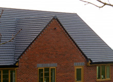 New installed roof using dark grey tiles
