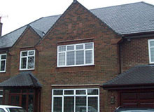 side view of family home with large roof